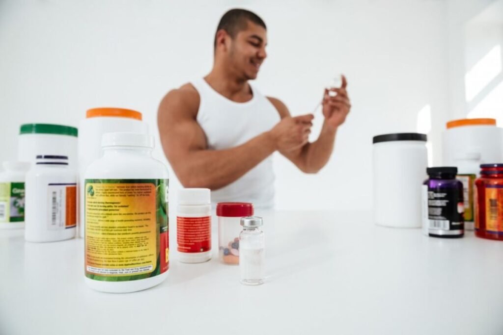 Various vitamin supplements including liquid and pill-form displayed on a table.