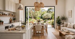 Bright open plan living space flowing to garden in Australian home
