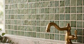 Kitchen splashback with handmade sage green zellige tiles