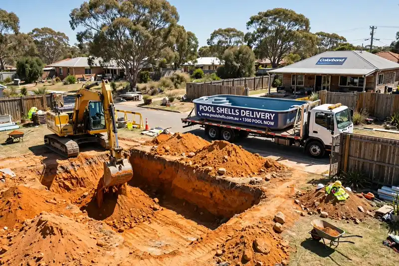 Excavator digging for a new inground swimming pool in an Australian suburban backyard