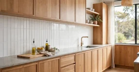 Kitchen splashback cost in Australia: white subway tile splashback with timber cabinetry