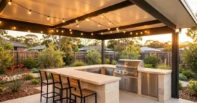 Covered alfresco outdoor kitchen with stone benchtop and built-in BBQ in an Australian backyard